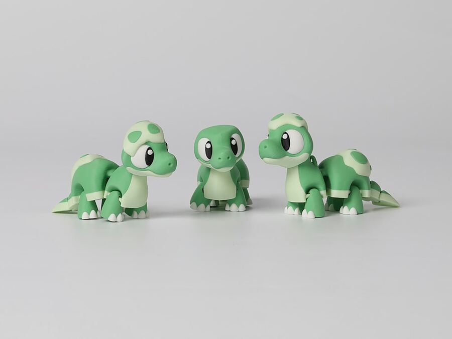 Three green turtle figurines
