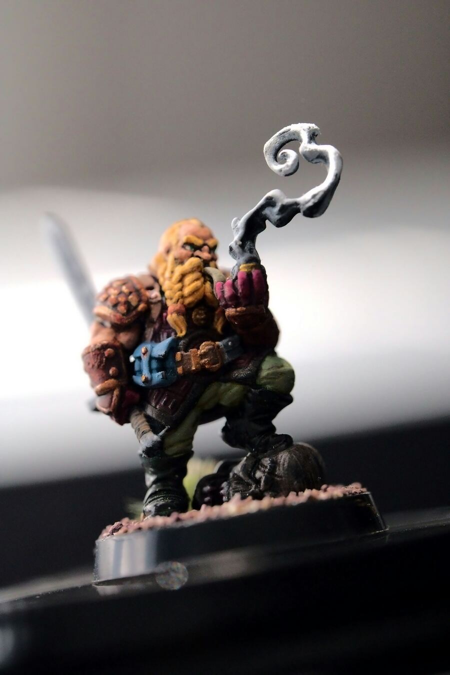 Painted dwarf miniature smoking a pipe