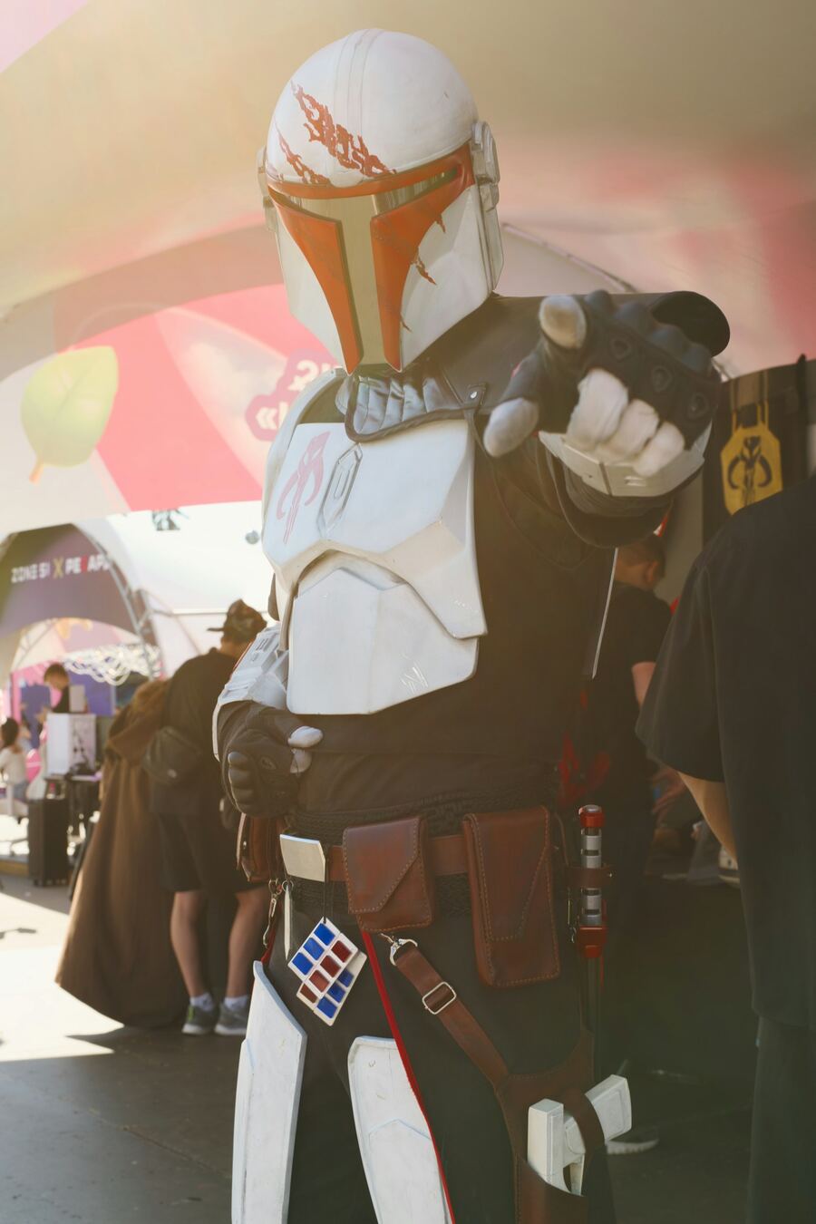 Cosplayer in white armor at a convention