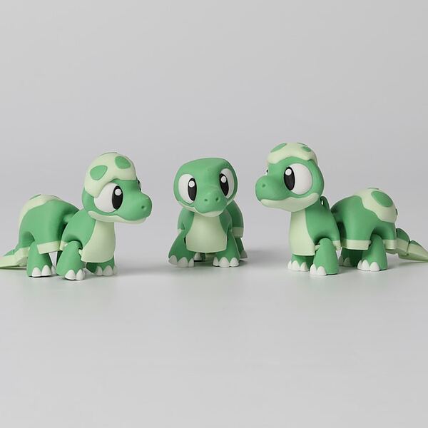 Three green turtle figurines